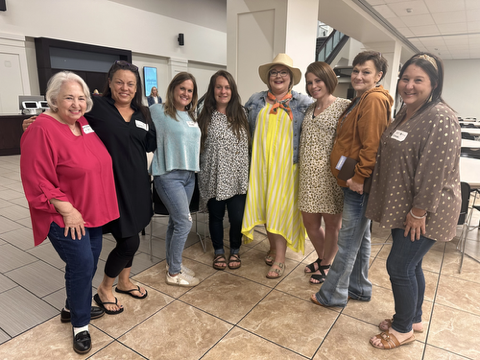 Women in the Mercy House program gathered together outdoors